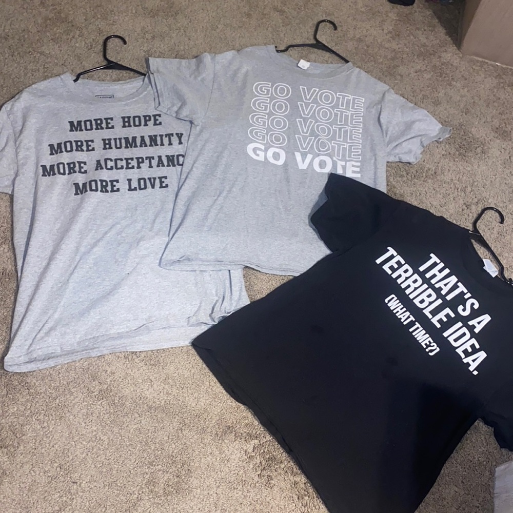 three t-shirts. all with images on the front and a plain backside.